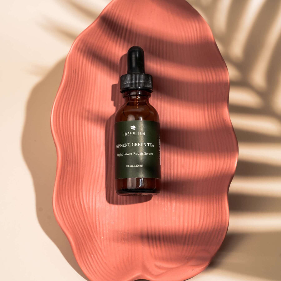 Anti Aging Serum on a coral-colored leaf-shaped plate