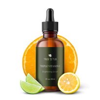 Tree To Tub Triple Vitamin C serum on white background with lemon, lime and orange slice garnishes