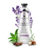 Lavender Hand Cream in silver-colored tube with black cap, around it are lavender flowers, aloe vera, shea butter and cacao seeds.