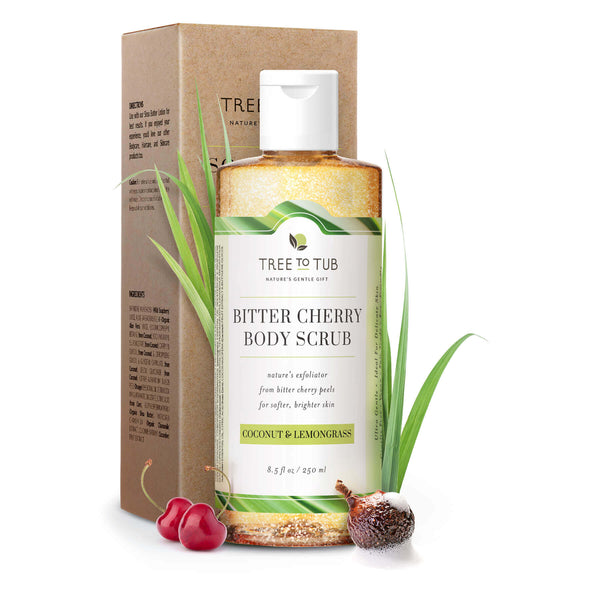 Bitter Cherry Body Scrub bottle with flip top cap  in front of its kraft box, around it are bitter cherry fruit, lemongrass and soapberry.