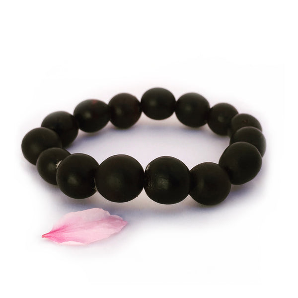 A beautiful mala bracelet with smooth black soapberry seeds. Made by Mrs. Wang with leftover seeds from the soapmaking process.