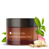 Ginseng Green Tea Anti Aging Retinol Eye Cream amber-colored jar with rose petals, green tea leaves and ginseng root slices on its side